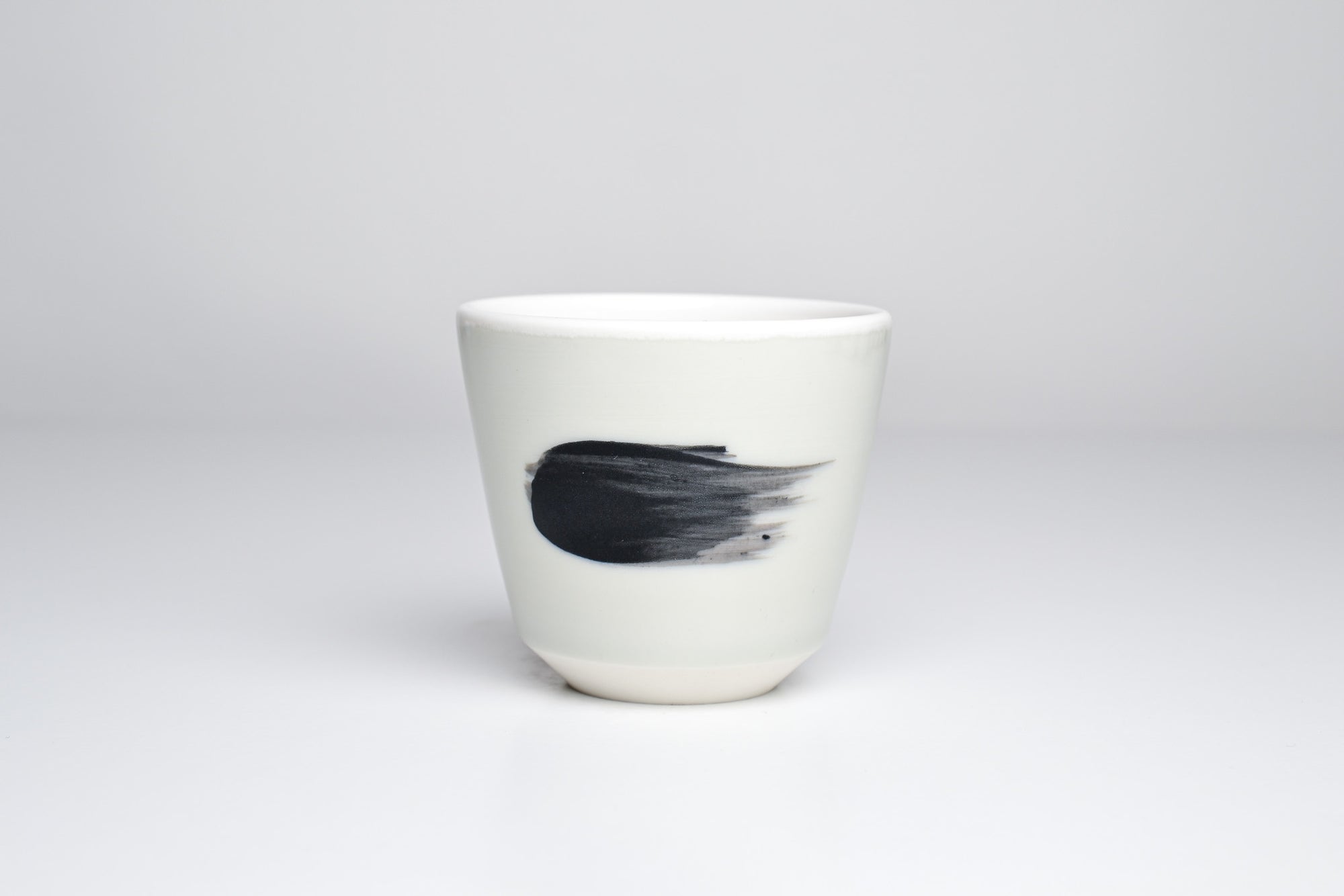 Celadon cup with black line